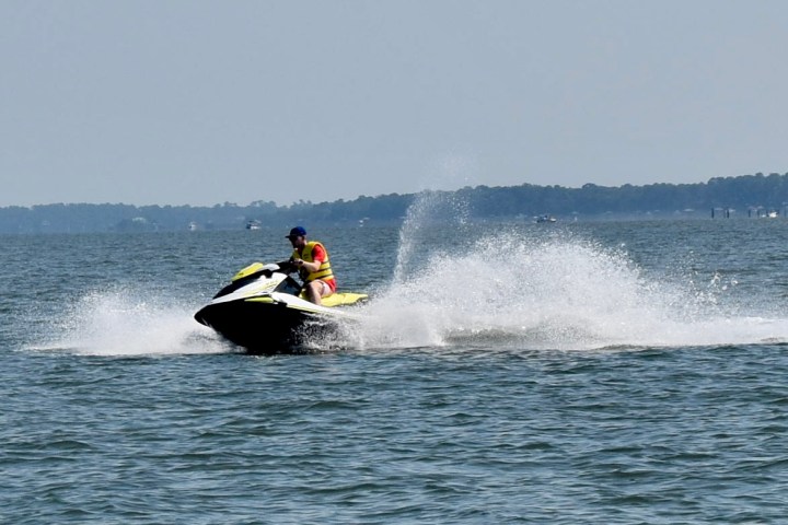 a man riding a wave on a surfboard in the water