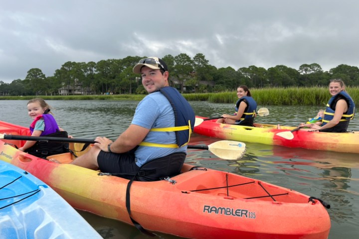 a group of people sitting on a boat