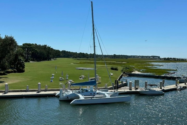 a boat is docked next to a body of water