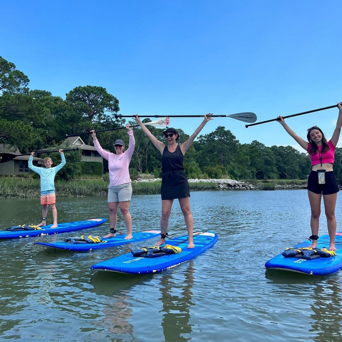 a group of people riding on the back of a boat
