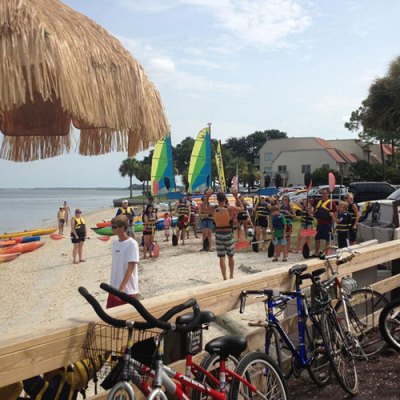 a group of people riding on the back of a bicycle
