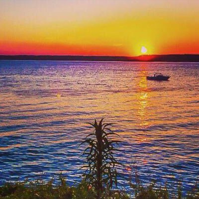 a sunset over a body of water