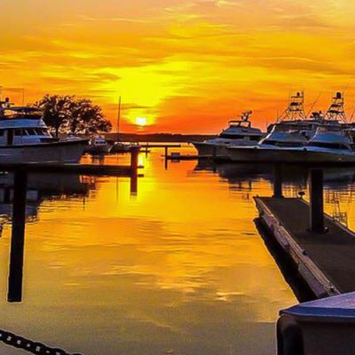 a boat docked at sunset