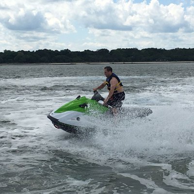 a man riding a wave on a surf board on a body of water
